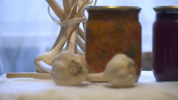 Jars with pickled vegetables on white background. — Stock Video