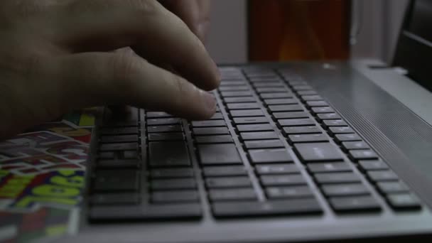 Men's hands are typing on the laptop's keyboard. Slow motion — Stock Video