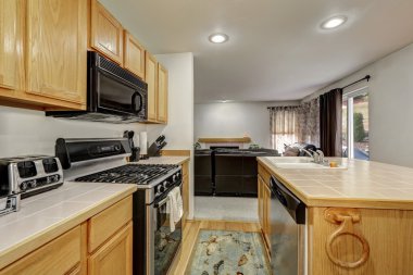 Wooden kitchen interior with large kitchen island