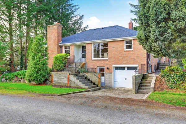 American red brick two story house exterior with garage — Stock Photo, Image