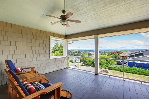 Spacious covered walkout deck with outdoor seats — Stock Photo, Image