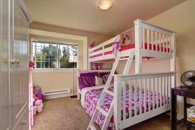 Lovely girls bedroom with bunk bed and carpet floor. clipart