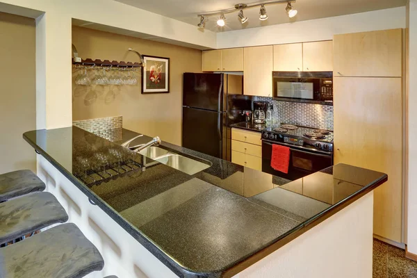 Small kitchen room in black and beige tones — Stock Photo, Image