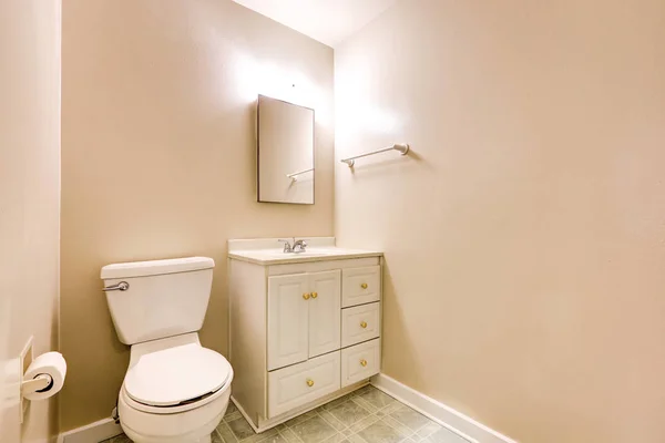 View of half bathroom with beige walls and tile floor — Stock Photo, Image