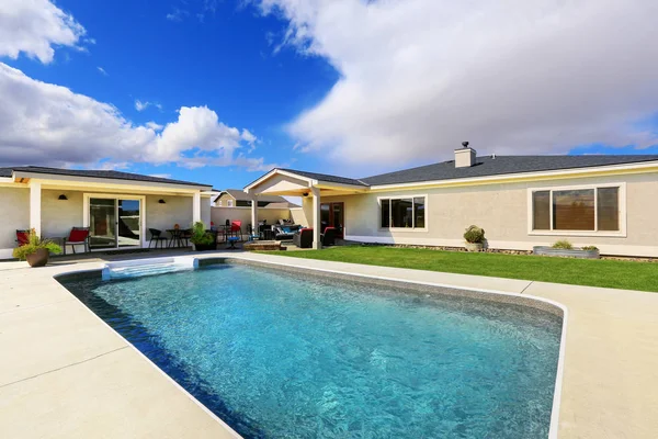 Swimming pool at the back yard of luxury house