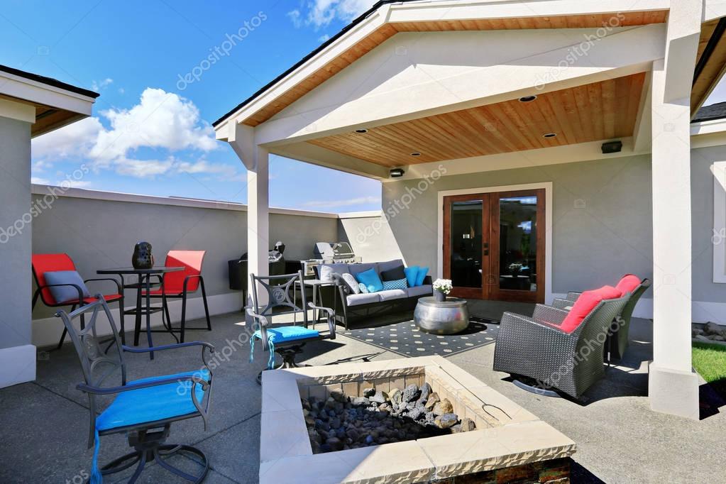 Traditional back porch with decking and a roof extension. Stock Photo