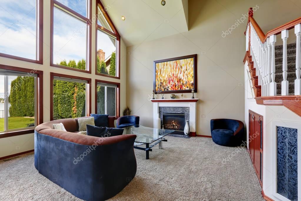 American Living Room With High Vaulted Ceiling And Water
