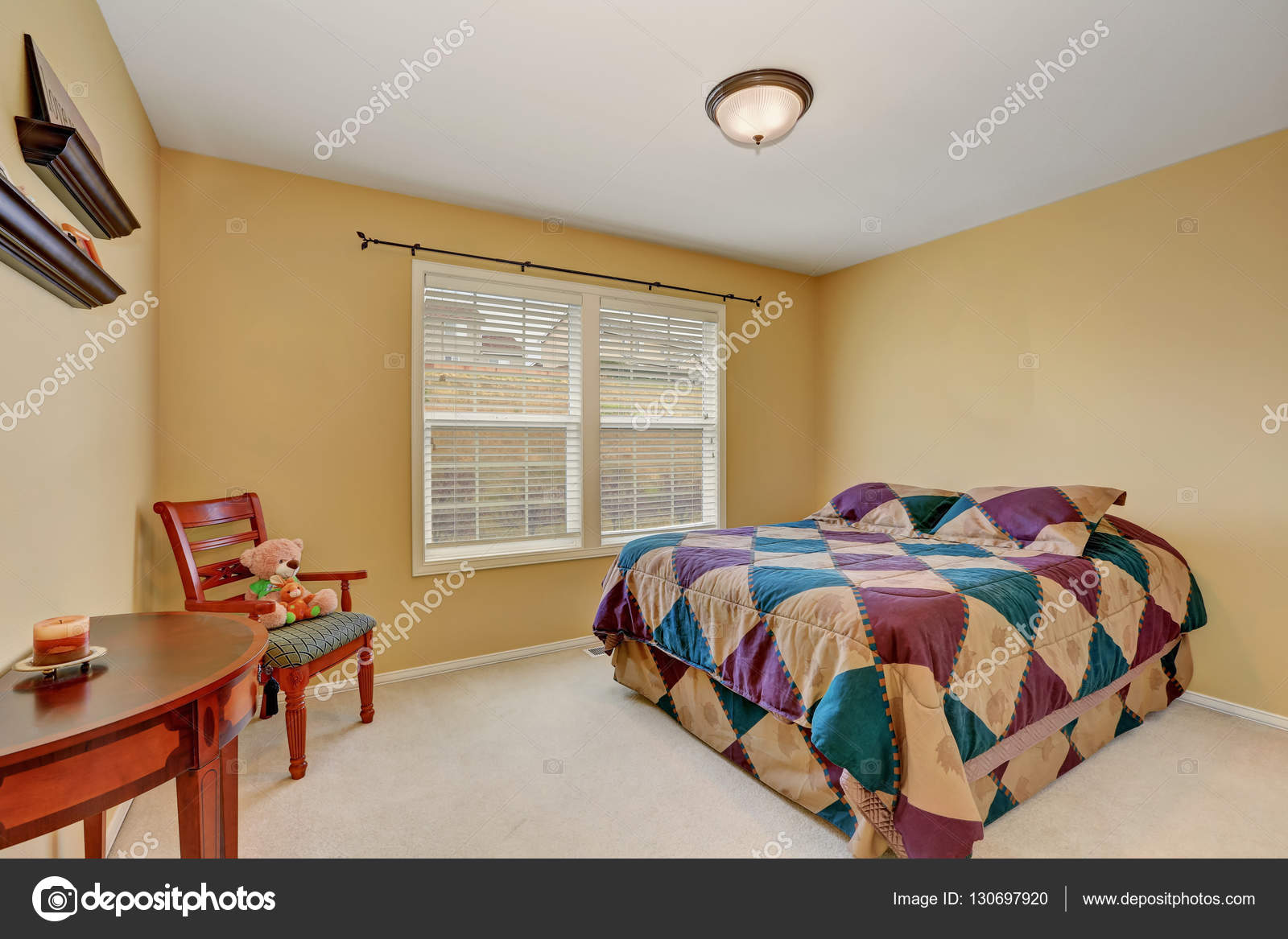 Kids Bedroom With Colorful Bed And Pastel Yellow Walls