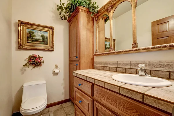 Bathroom vanity cabinet with vintage style mirror — Stock Photo, Image