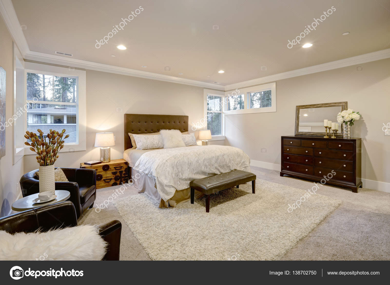 Beige And Brown Master Bedroom Boasts Tufted Queen Bed