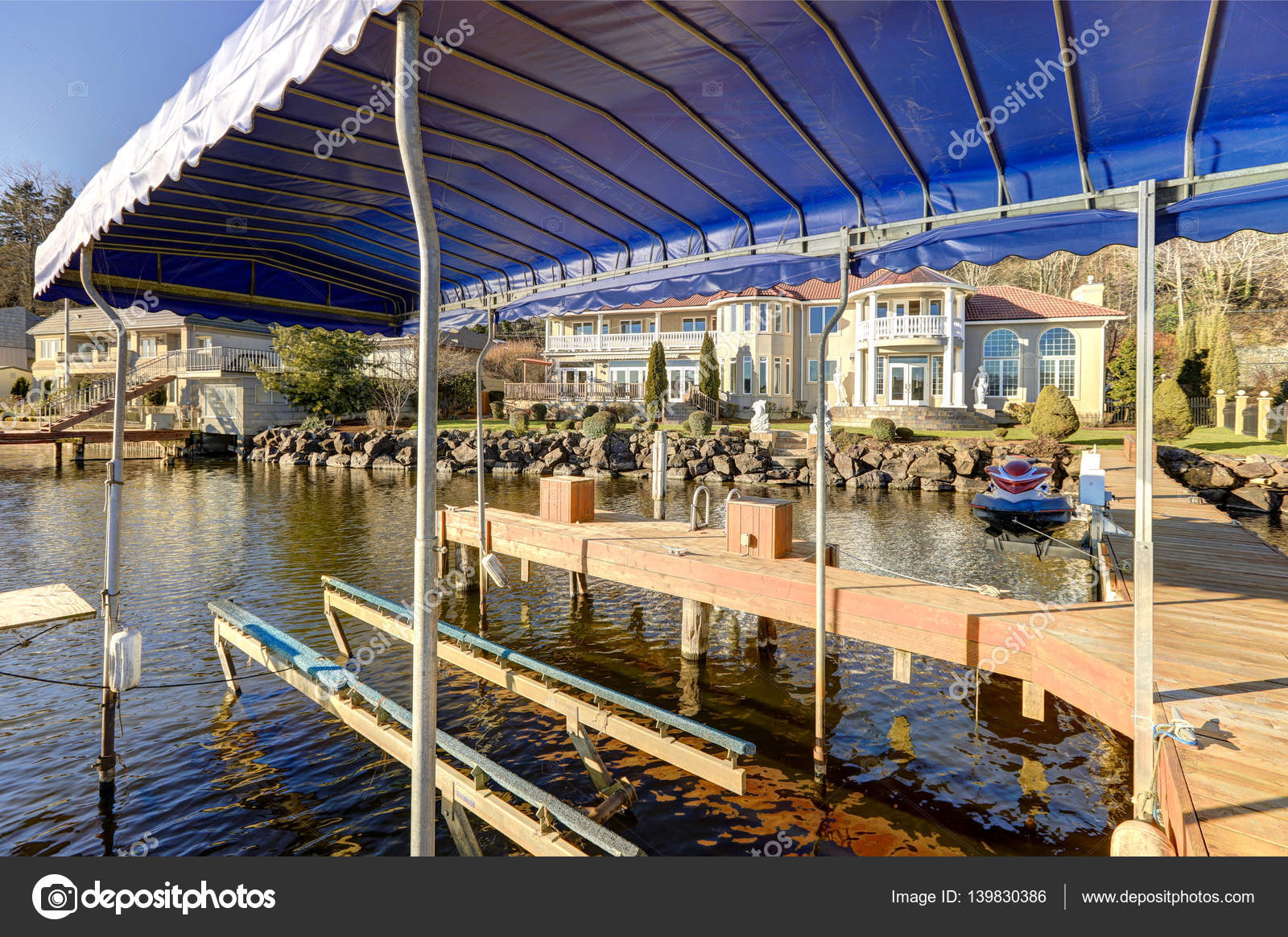 Private dock with jet ski lifts and covered boat lift, Lake Washington