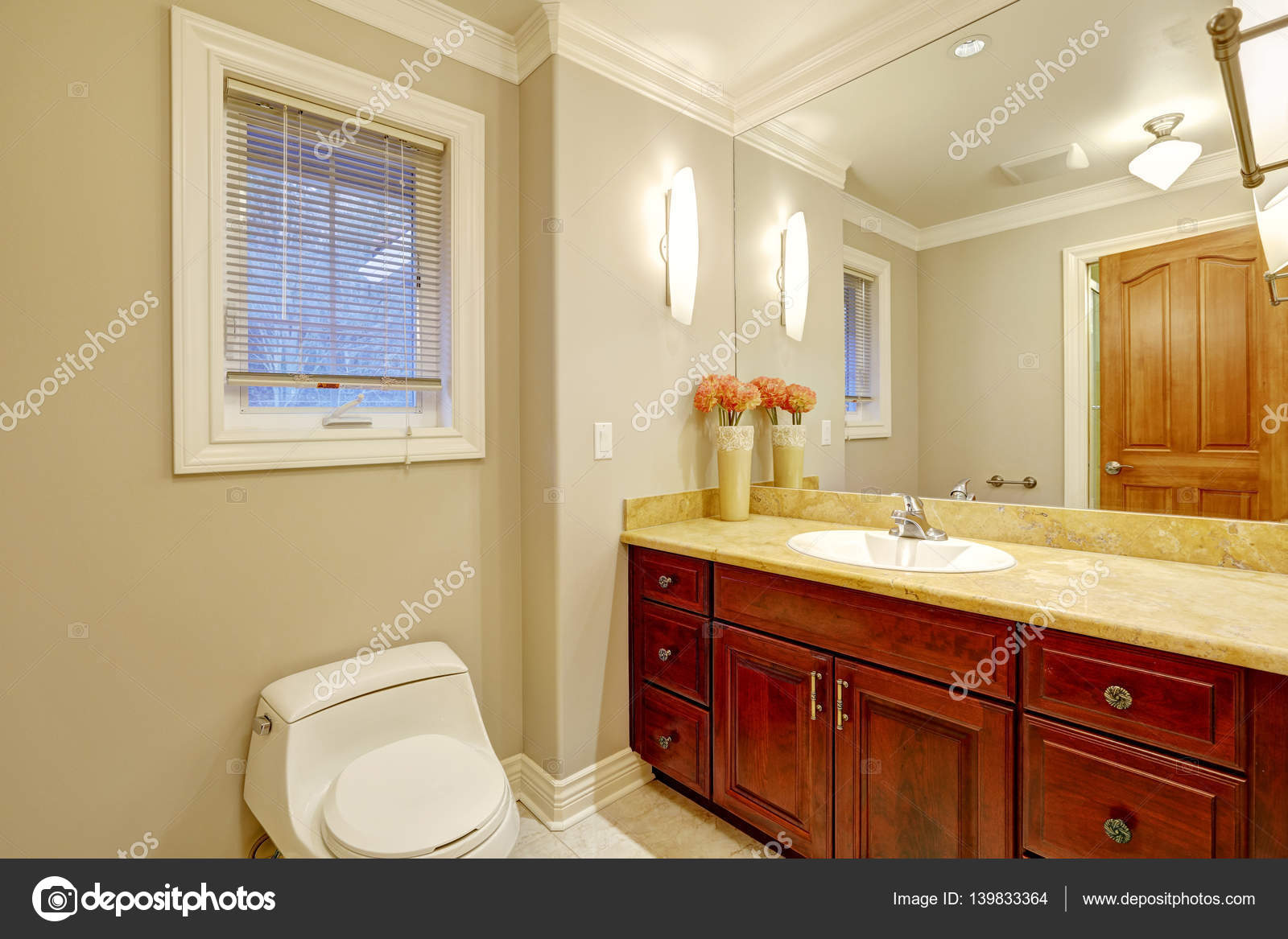 Light Tones Bathroom Interior With Vanity Cabinet Stock Photo