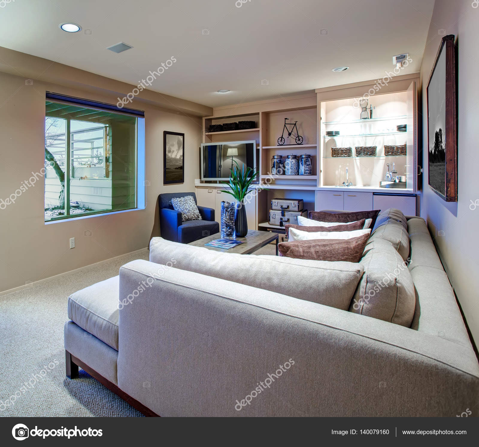 Welcoming Living Room Features Built In Wet Bar Stock