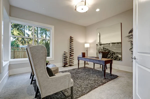 Brown and beige office design boasts wood table with turned legs — Stock Photo, Image