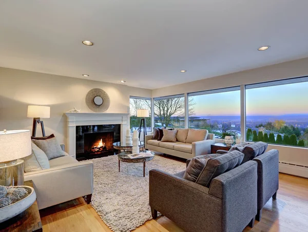 Warm light brown living room with panoramic window view. — Stock Photo, Image