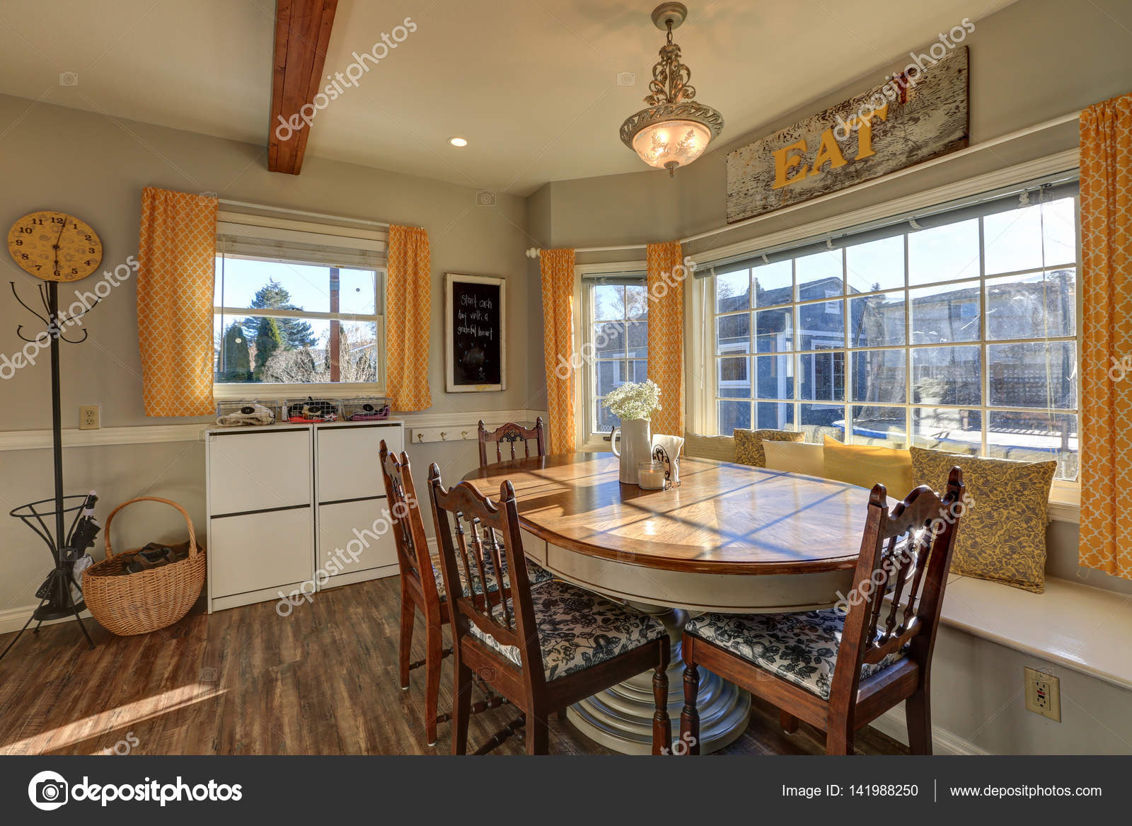 Sun filled breakfast nook with window seat Stock Photo by