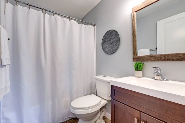 Compact light bathroom with soft gray walls — Stock Photo, Image