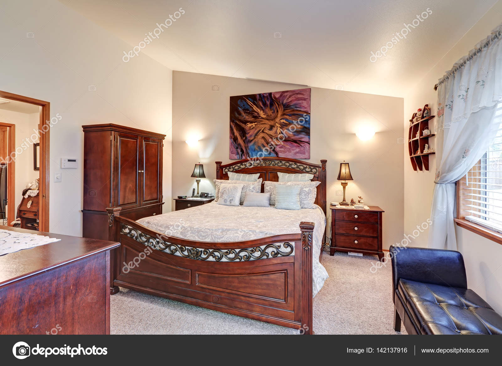 Chic Master Bedroom Features Vaulted Ceiling Stock Photo