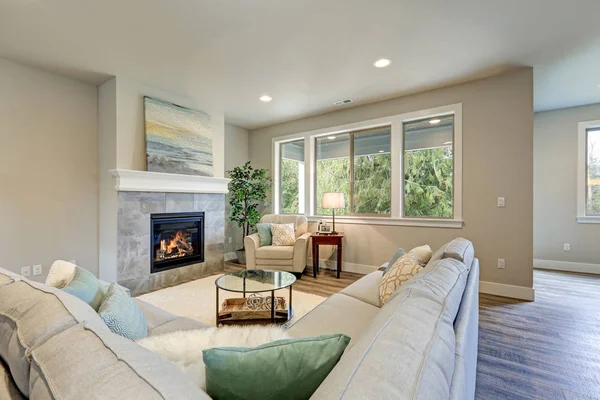 Family room interior features grey linen sectional — Stock Photo, Image