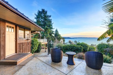 Modern two story panorama house with view of Puget Sound clipart