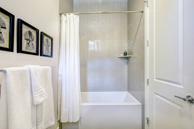 White and grey bathroom interior with a shower clipart