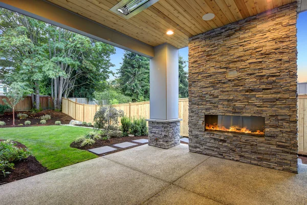 Outside Patio boasts gorgeous stone Fireplace — Stock Photo, Image