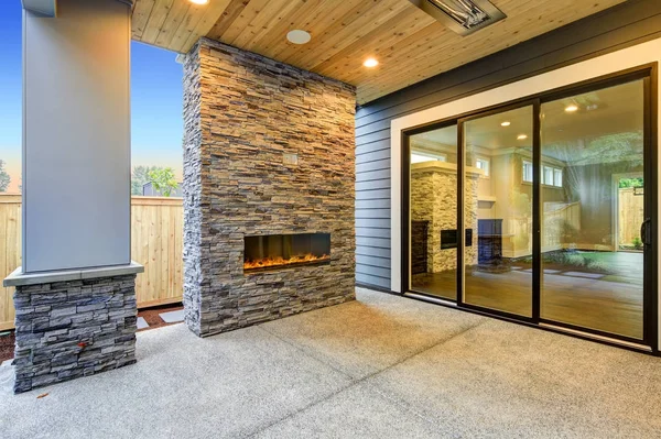 Outside Patio boasts gorgeous stone Fireplace — Stock Photo, Image