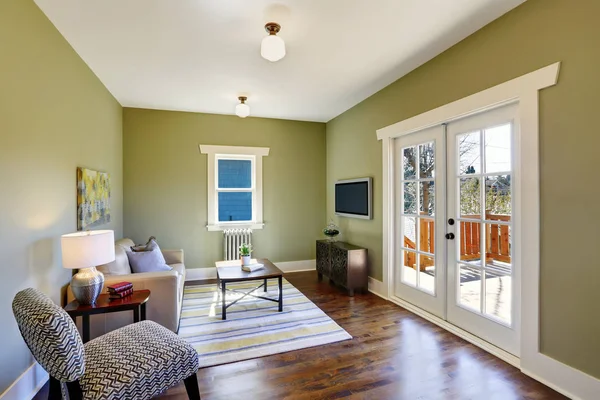 Green living room with fir floor — Stock Photo, Image