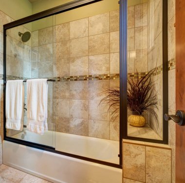 Master bathroom interior with close up of glass shower clipart