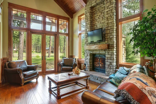 Stunning living room design with a stone wall fireplace