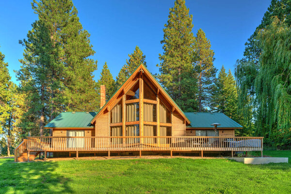 Beautifufl large cedar home with pond and pine trees.
