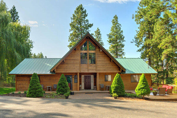 Beautifufl large cedar home with pond and pine trees.