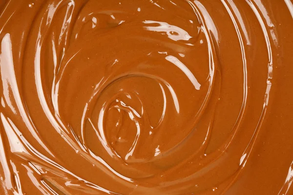 Olvasztott csokoládé háttér — Stock Fotó