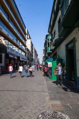 LIMA / PERU - May 10 2016:  People walking thru alleyways in the city of Lima in Peru.