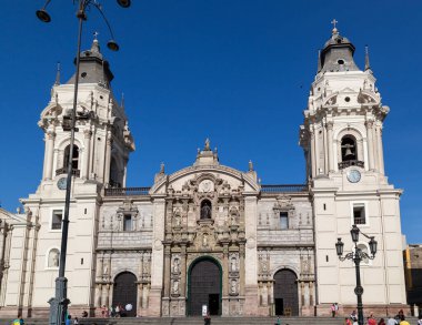 LIMA / PERU - May 10 2016: A Catholic Cathedral in the Plaza de Armas with detailed statues and pillars on the facade in Lima, Peru.