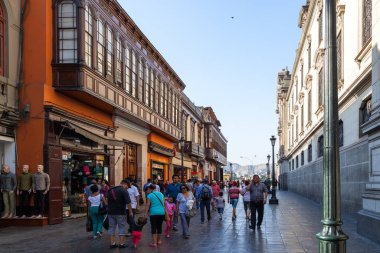 LIMA / PERU - May 10 2016:  People walking thru alleyways in the city of Lima in Peru.