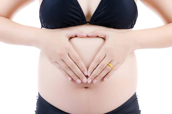 Schöne junge schwangere Dame isoliert auf dem weißen Hintergrund. — Stockfoto