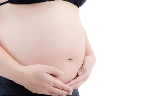 Mooie jonge zwangere dame geïsoleerd op de witte achtergrond. — Stockfoto