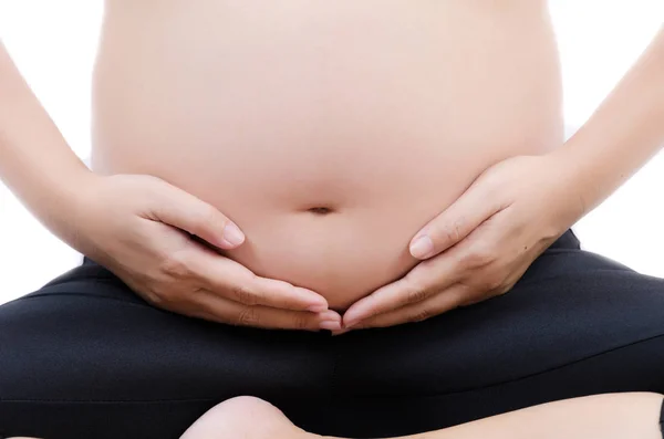 Όμορφη νεαρή κοπέλα έγκυος απομονώνονται σε λευκό φόντο. — Φωτογραφία Αρχείου
