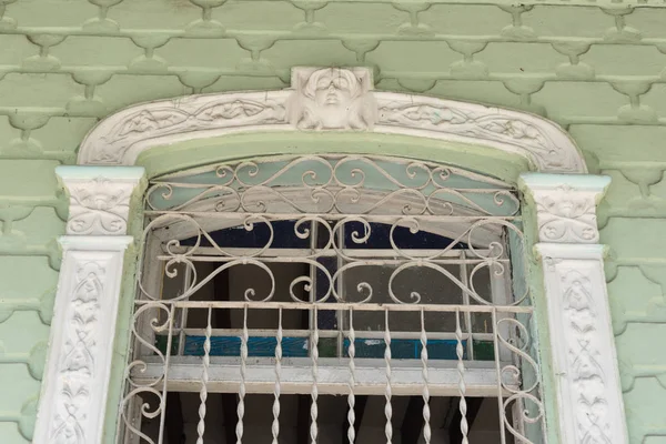 Cuban old colonial architecture: detail of elaborated window