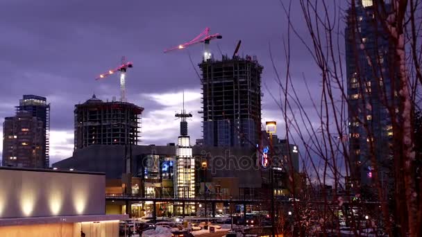 Motion of modern business building and construction cranes was decorated xmas light — Stock Video