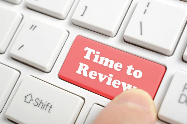 Pressing time to review key on keyboard — Stock Photo, Image
