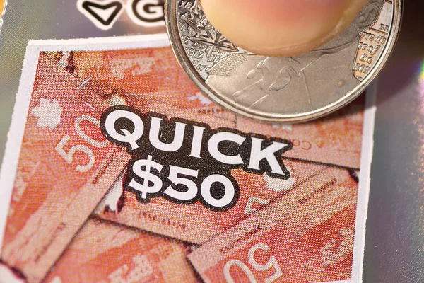 Close up woman scratching lottery ticket. — Stock Photo, Image