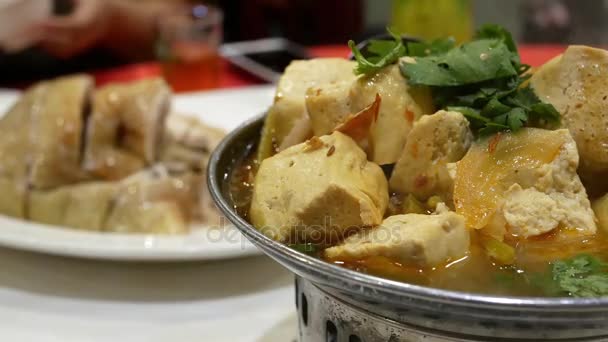 One side of hot pot with heavy steam inside Chinese restaurant — Stock Video