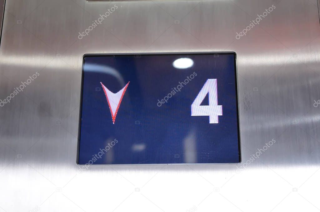 Digital display showing four floor number inside elevator