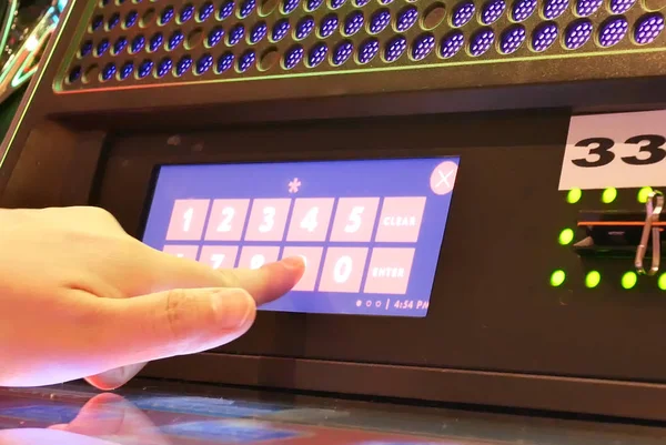 Motion of people pressing pin number on slot machine for redeem money inside Casino — Stock Photo, Image