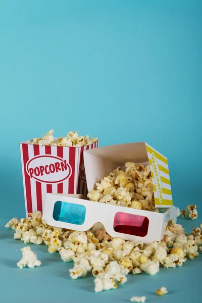 Popcorn bucket against a blue background