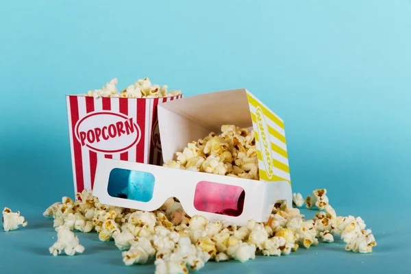 Popcorn bucket against a blue background