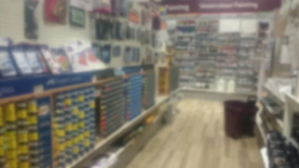 Stacked shelves inside a craft shop. Out of focus. — Stock Photo, Image