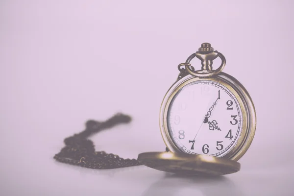 Pocket watch against a light background Vintage Retro Filter. — Stock Photo, Image